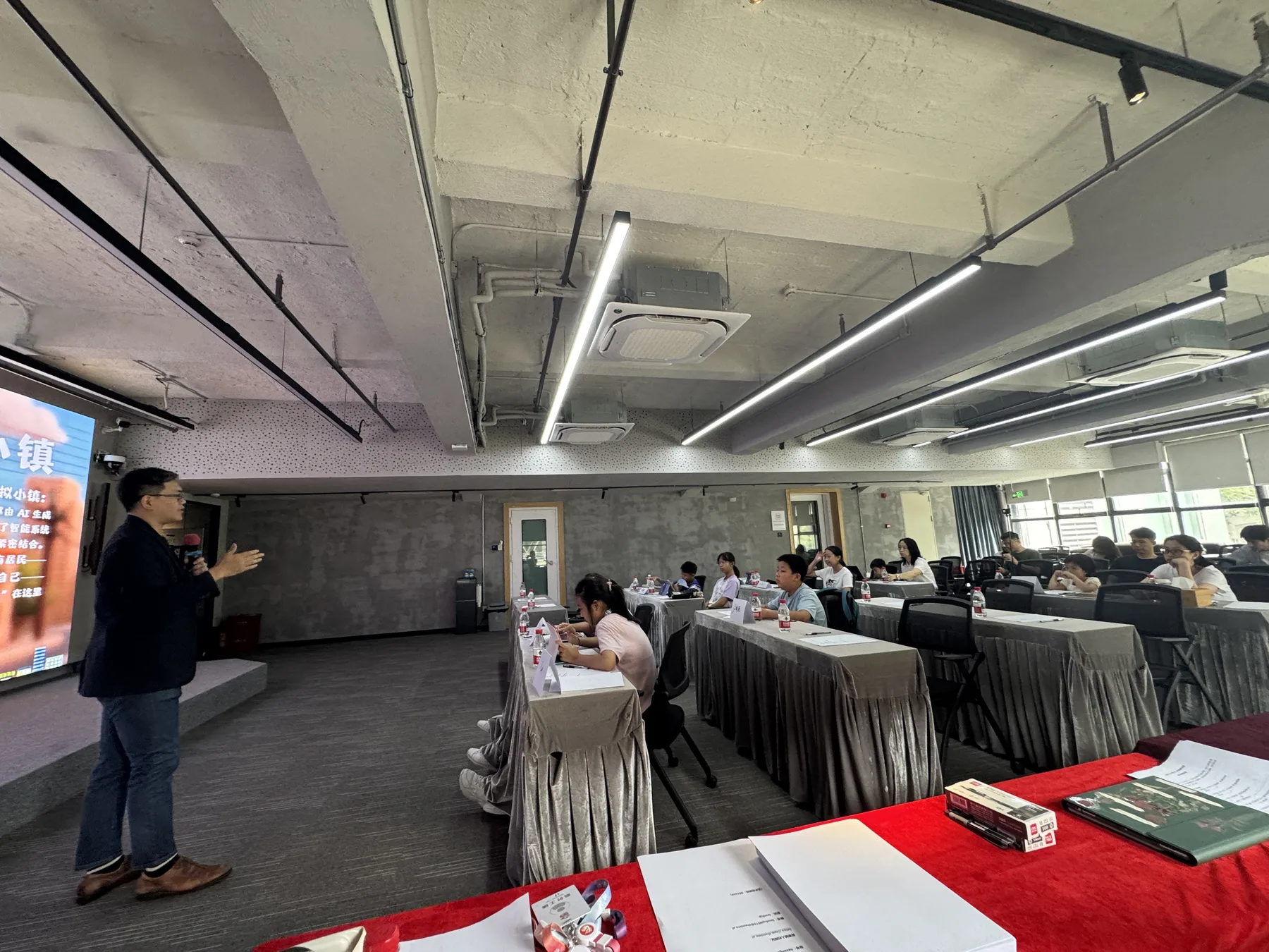Workshop tutor presenting the AI town activity